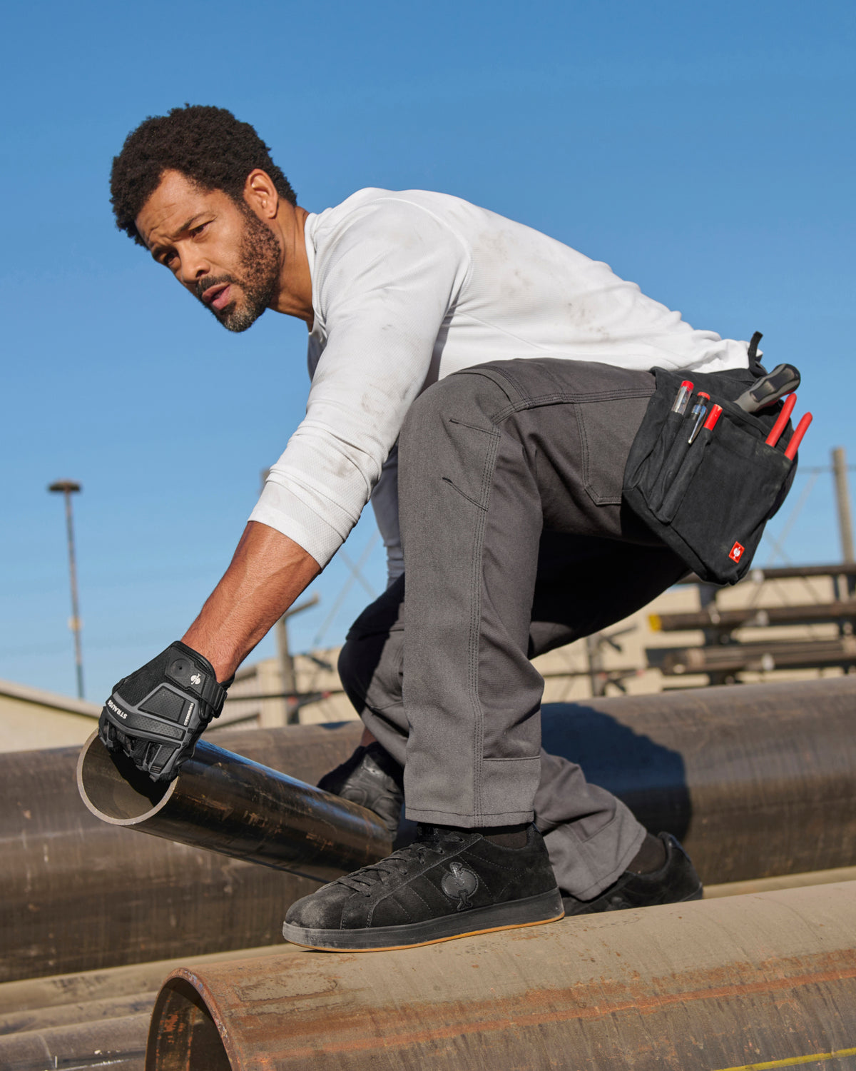Pocket Protected Work Pants e.s.iconic in carbon gray shown in an outdoor workwear setting