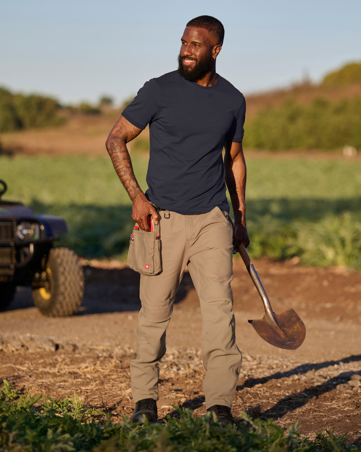 Lifestyle view of Pocket Protected Work Pants e.s.iconic in almond brown during work