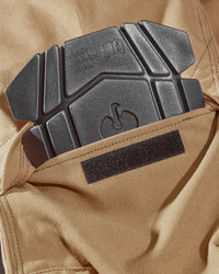 Close-up of knee pad pocket details on Pocket Protected Work Pants e.s.iconic in almond brown