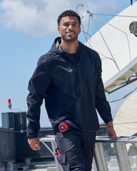 STRAUSS e.s.trail light pack windbreaker in black worn in a work setting