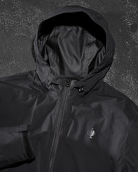 STRAUSS e.s.trail light pack windbreaker in black paired with workwear