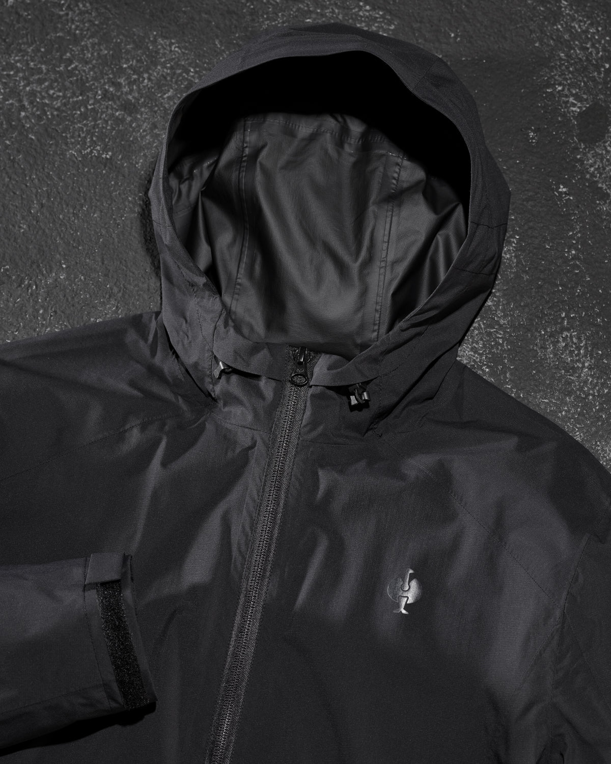 STRAUSS women's e.s.trail light pack windbreaker in black paired with workwear