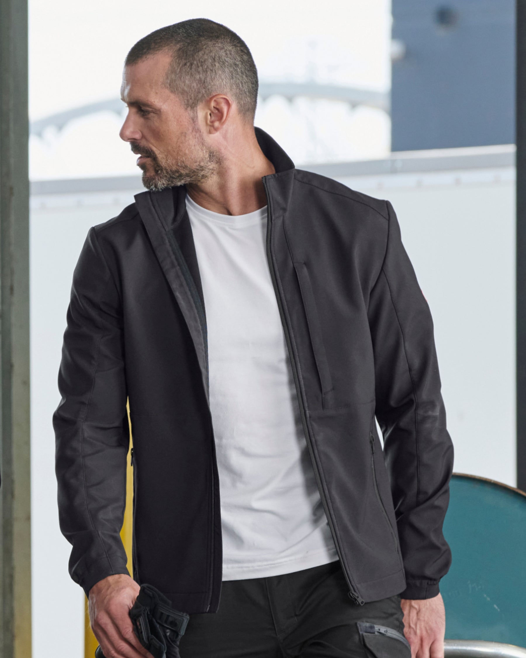 STRAUSS e.s.trail pure softshell jacket in black paired with workwear