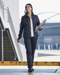 STRAUSS women's e.s.trail pure softshell jacket in black shown during outdoor work