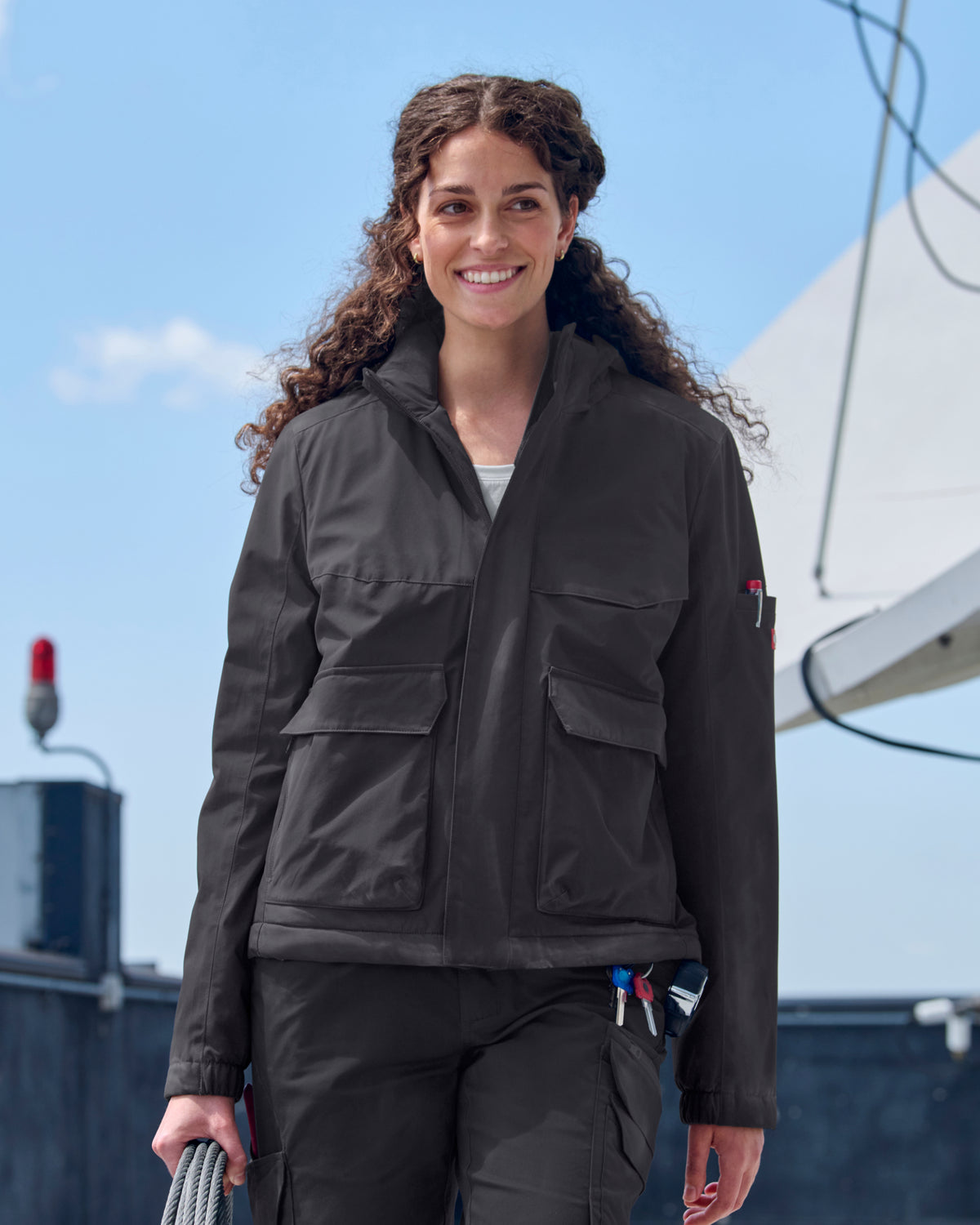 STRAUSS women's e.s.trail winter jacket in black worn in cold-weather work
