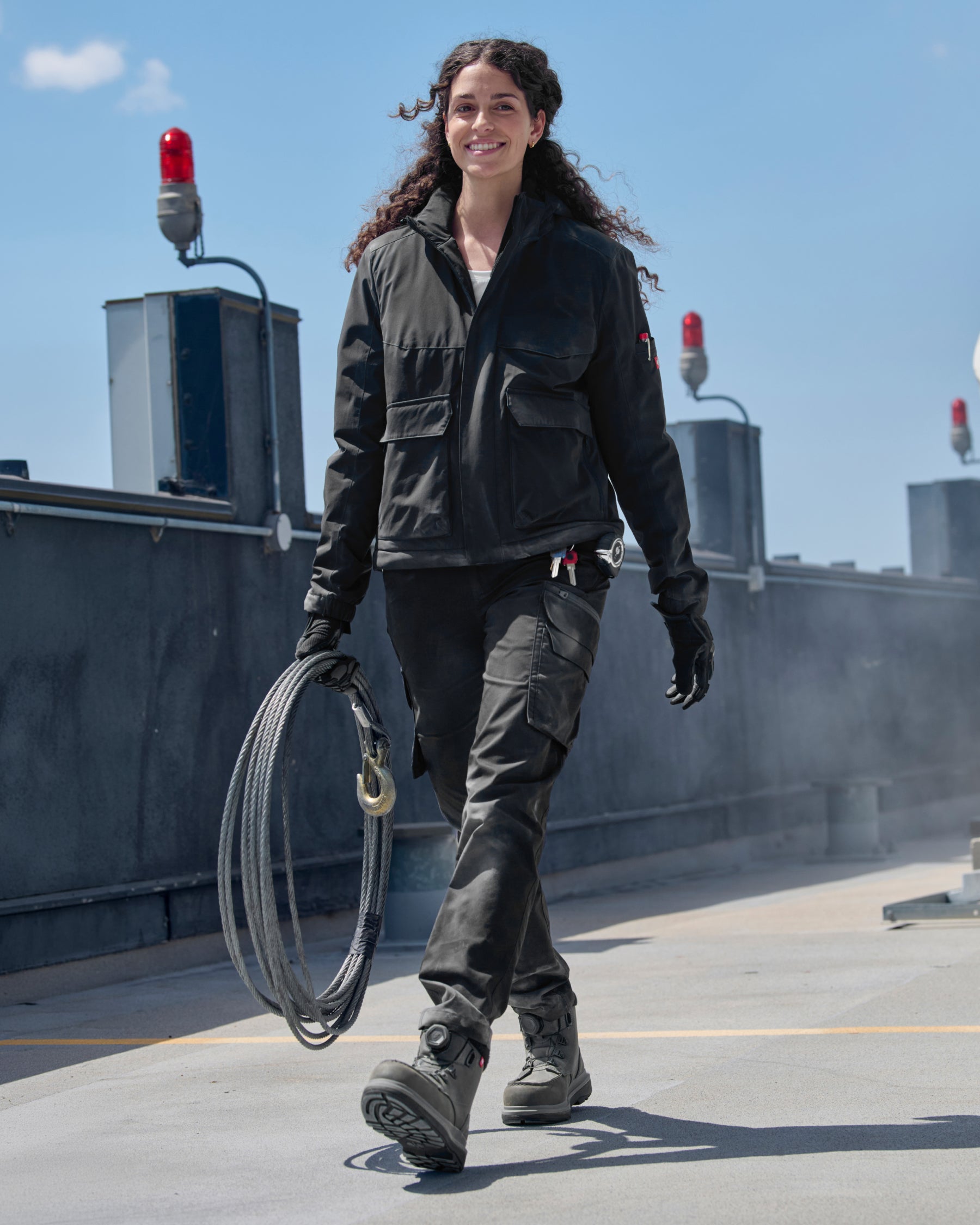 STRAUSS women's e.s.trail winter jacket in black shown during outdoor winter work