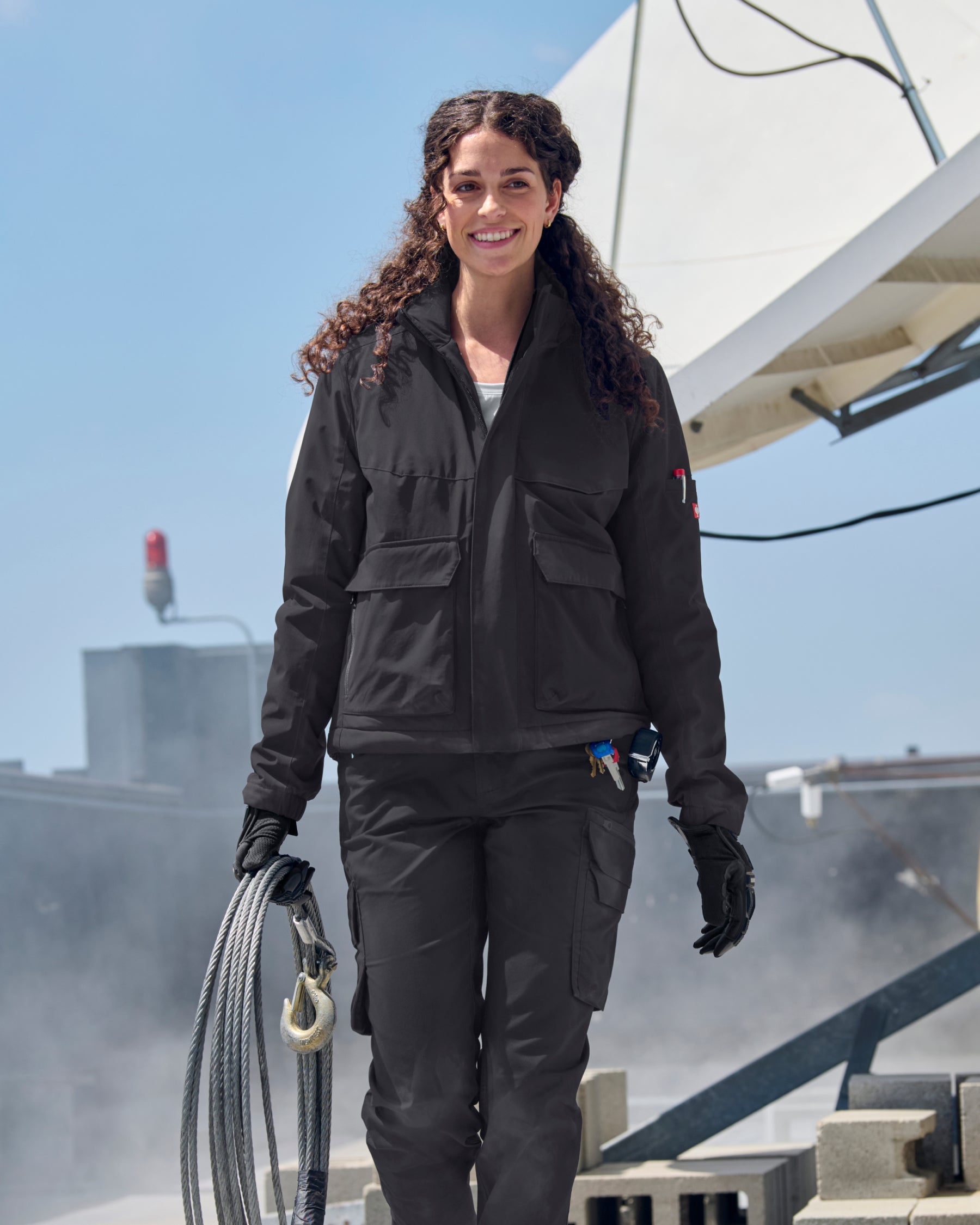 STRAUSS women's e.s.trail winter jacket in black in use in cold conditions