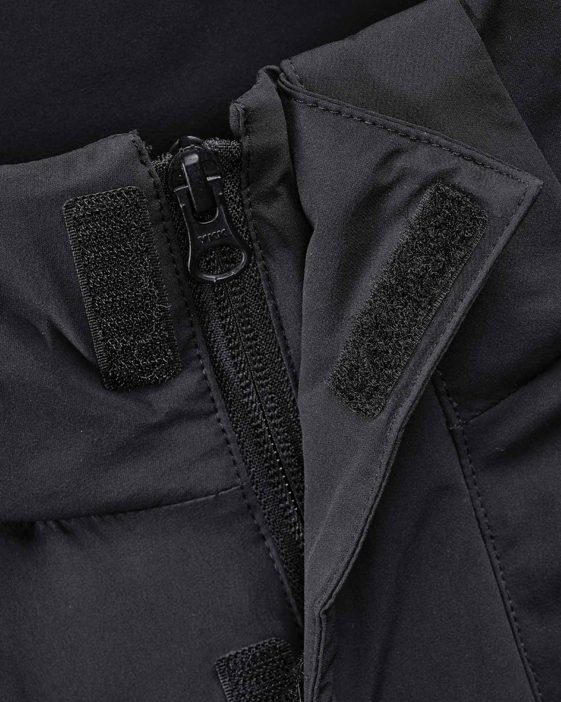 Close-up of insulated shell and hood details on STRAUSS women's e.s.trail winter jacket in black