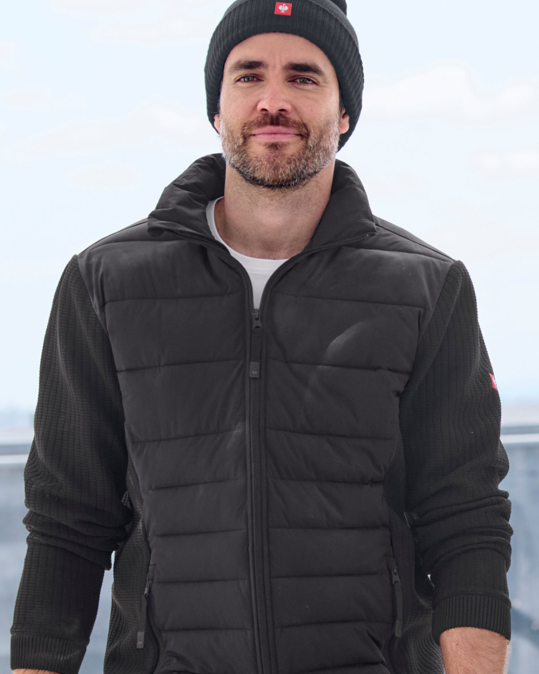 STRAUSS e.s.trail pure hybrid jacket in black shown during outdoor work