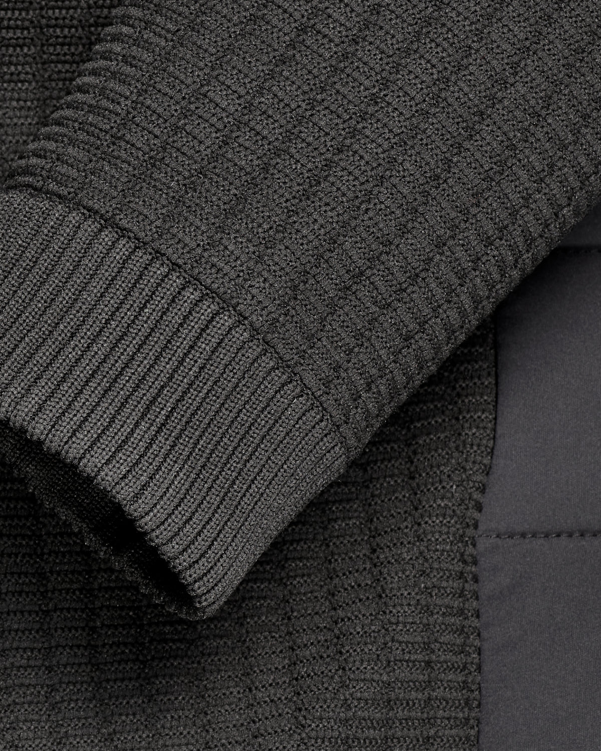Close-up of zipper and pocket details on STRAUSS e.s.trail pure hybrid jacket in black