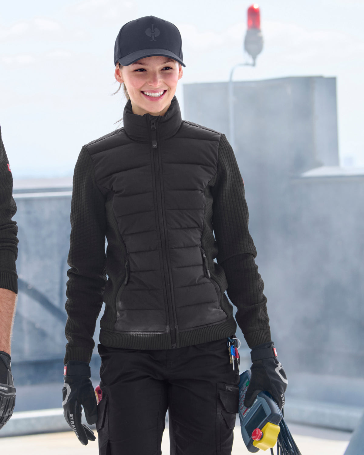 STRAUSS women's e.s.trail pure hybrid jacket in black worn in a work setting