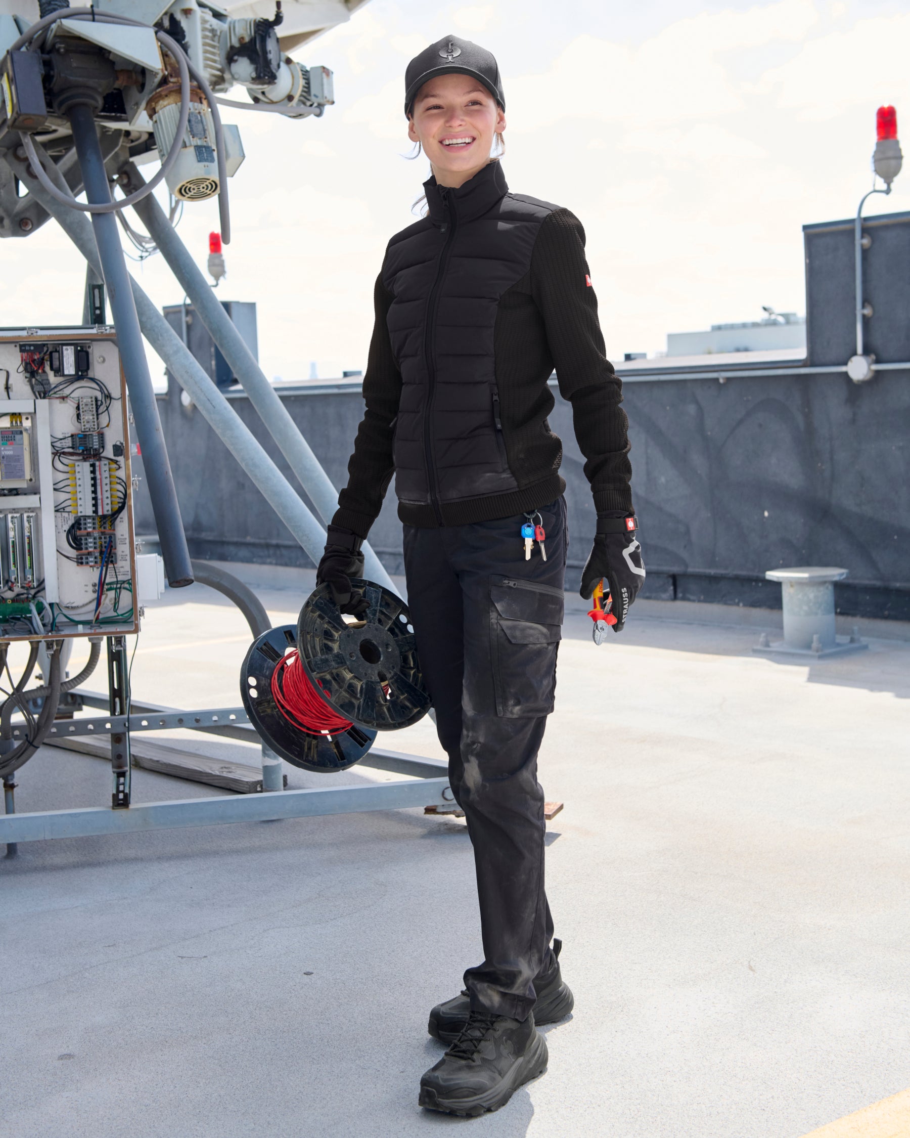 STRAUSS women's e.s.trail pure hybrid jacket in black in use on the job