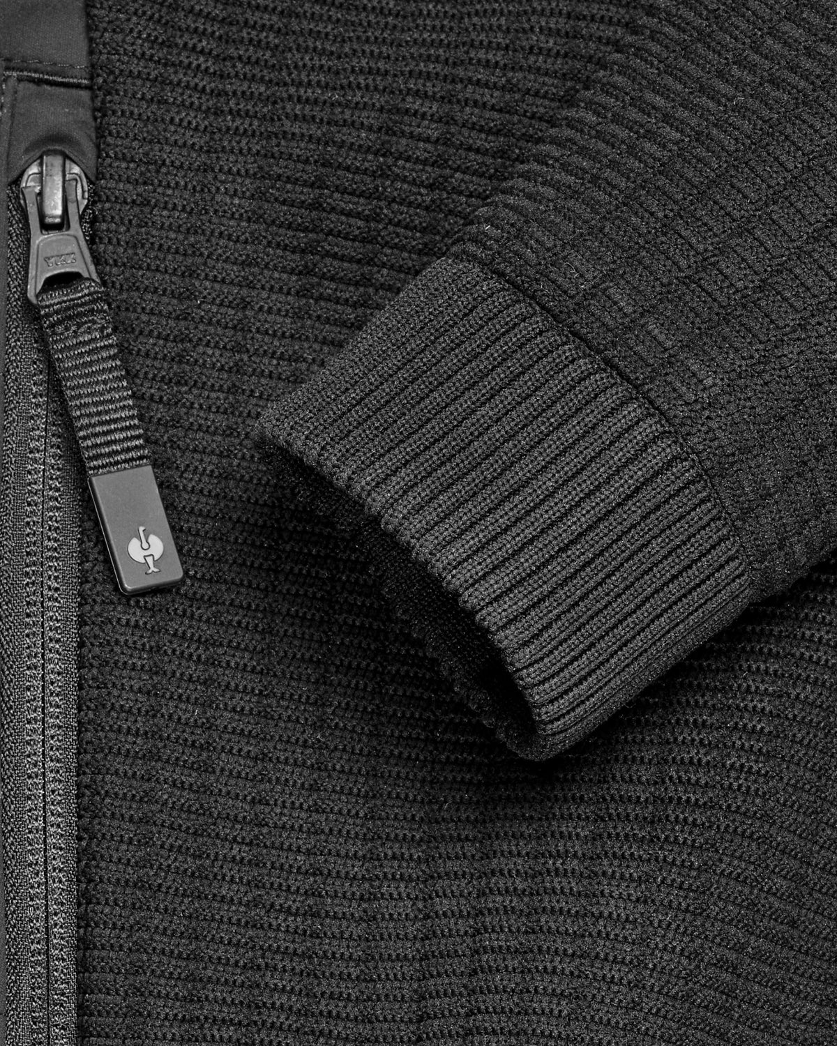 Close-up of zipper and pocket details on STRAUSS women's e.s.trail pure hybrid jacket in black