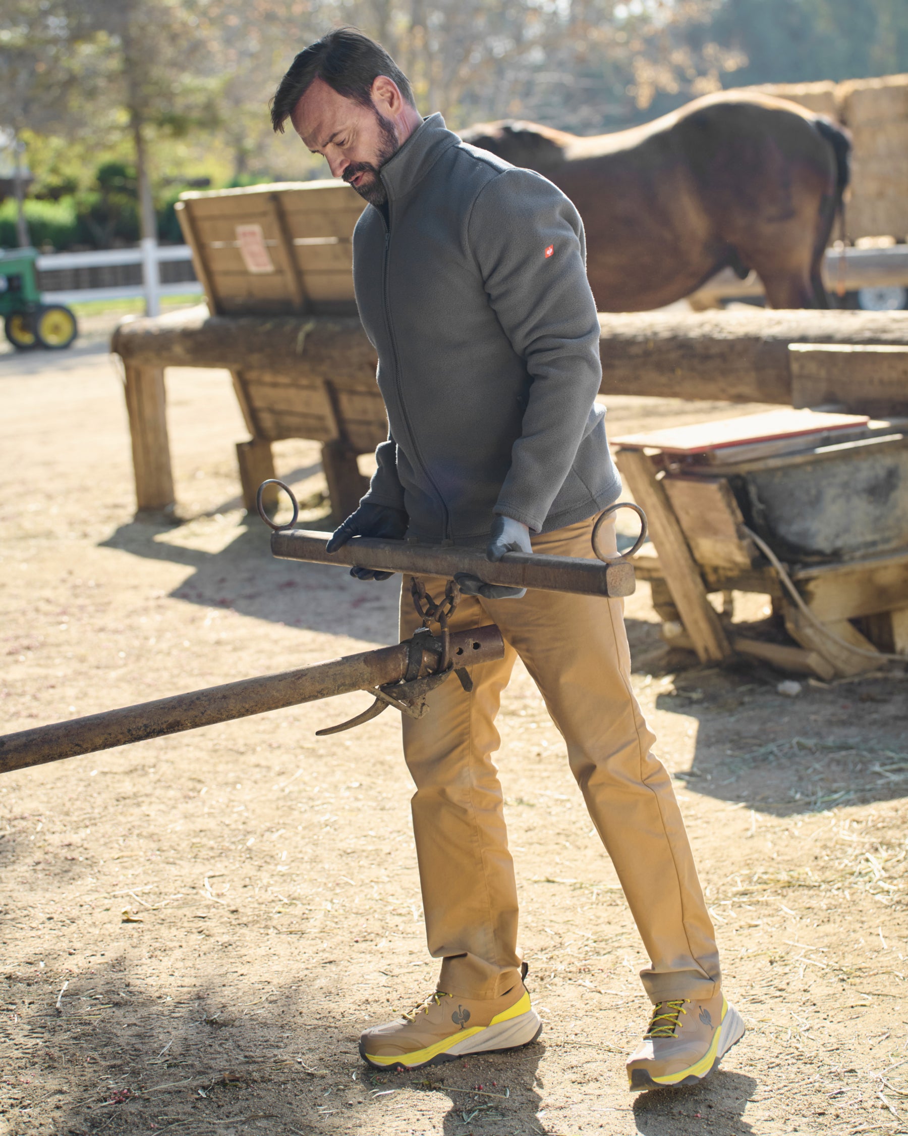 STRAUSS full-zip fleece jacket in carbon gray shown during outdoor work