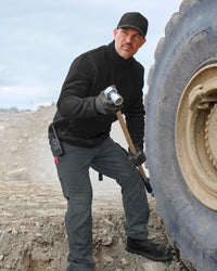 STRAUSS full-zip fleece jacket in black shown during outdoor work