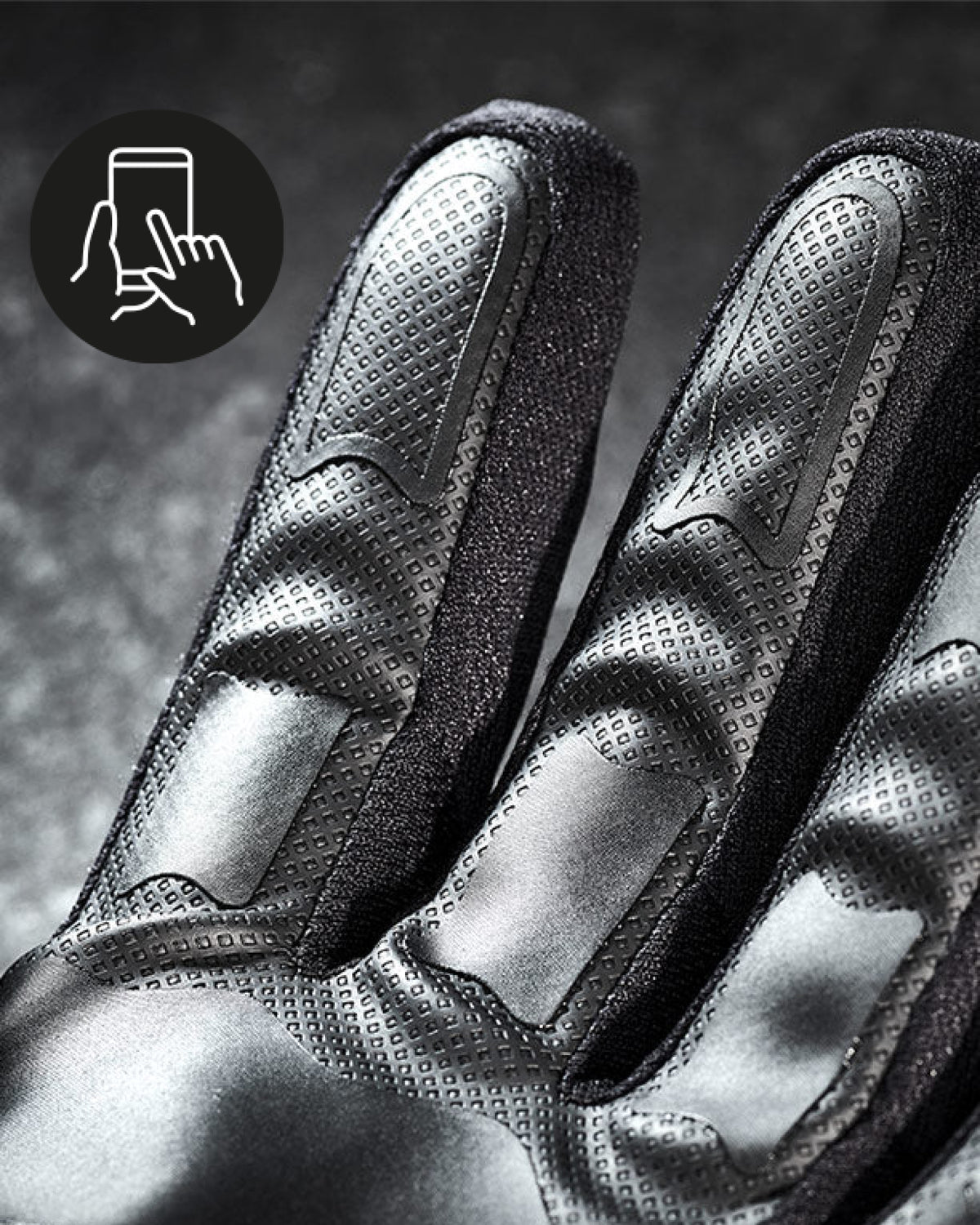 Close-up of the palm grip, fingers, and cuff on the black STRAUSS e.s.trail all-season gloves.