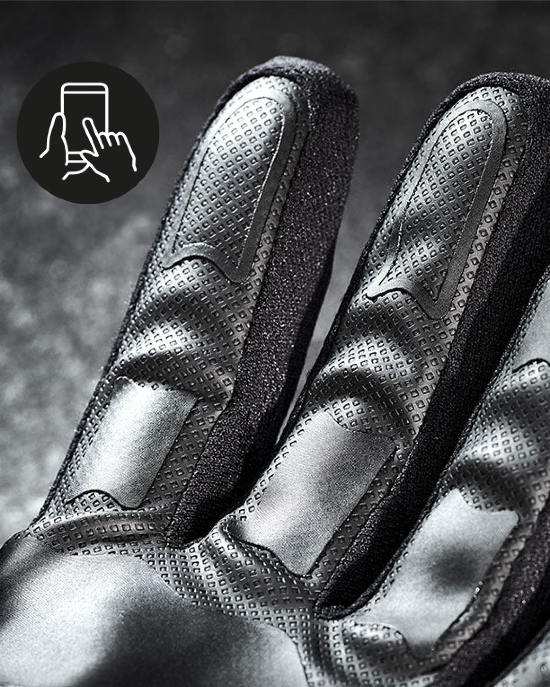 Close-up of the palm grip, fingers, and cuff on the black STRAUSS e.s.trail all-season gloves.