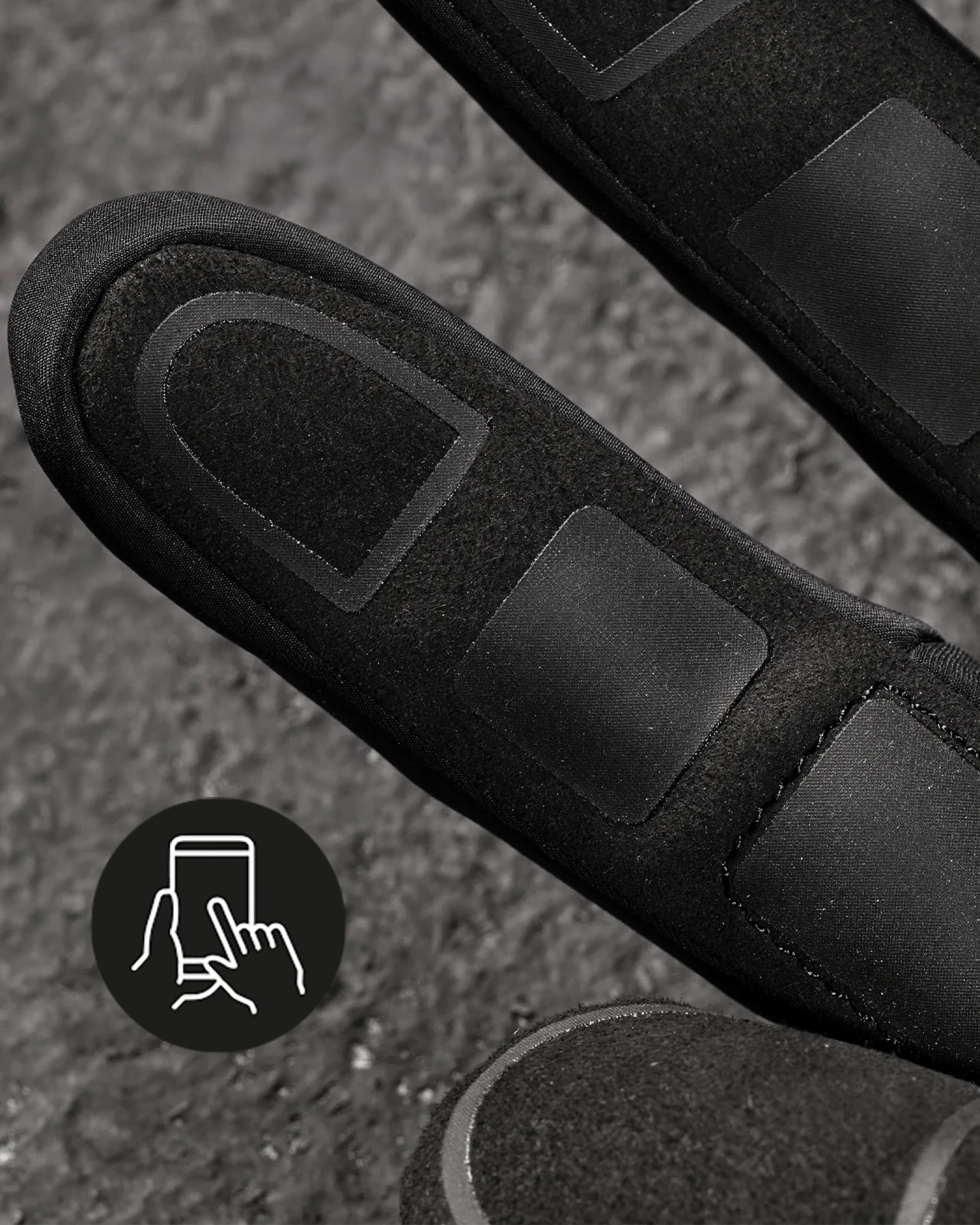 Close-up of the palm grip, fingers, and cuff on the black and basalt gray STRAUSS e.s.trail winter gloves.