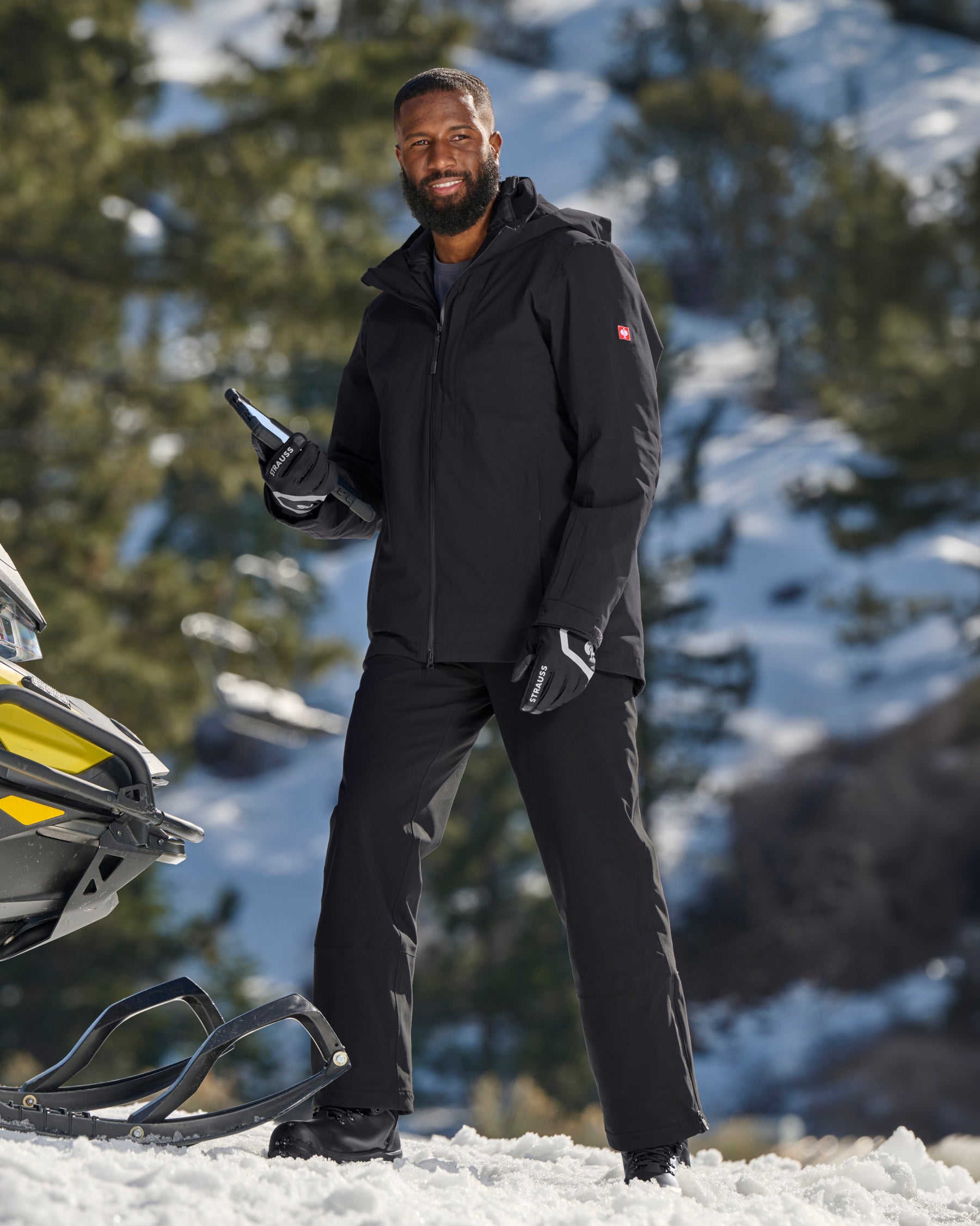STRAUSS e.s.trail pure 3-in-1 functional snow jacket in black shown during outdoor winter work