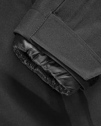 Close-up of insulated shell and hood details on STRAUSS e.s.trail pure 3-in-1 functional snow jacket in black