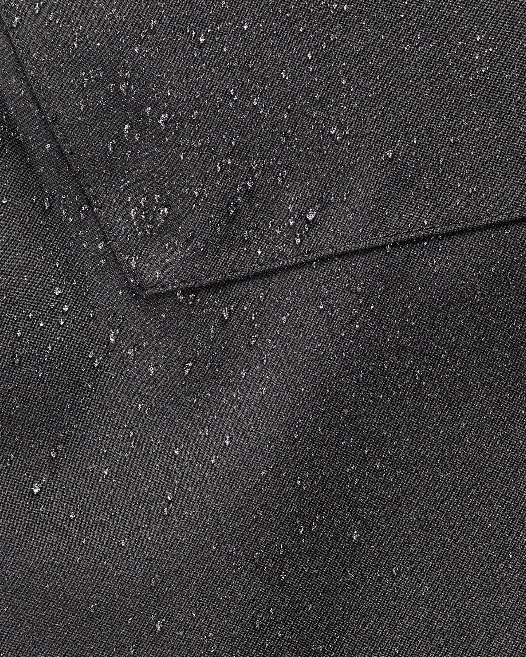Close-up of weather-ready fabric on Functional Snow Pants e.s.trail pure in black