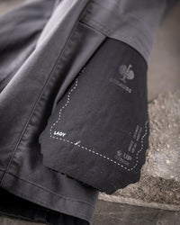 Close-up of the surface texture and ergonomic profile on the graphite STRAUSS comfort cell knee pads.