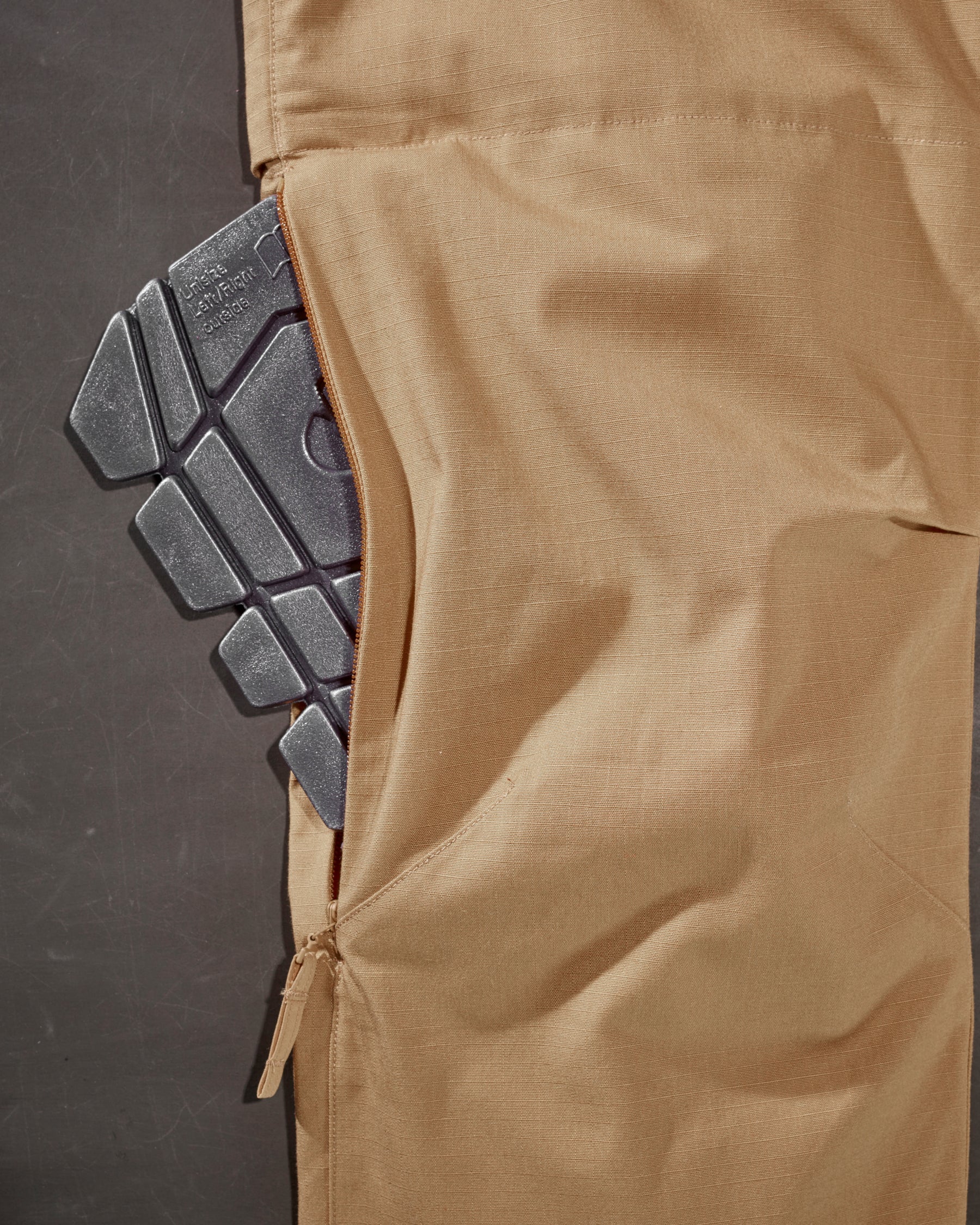 Close-up of the surface texture and ergonomic profile on the graphite STRAUSS ergonomic knee pads.