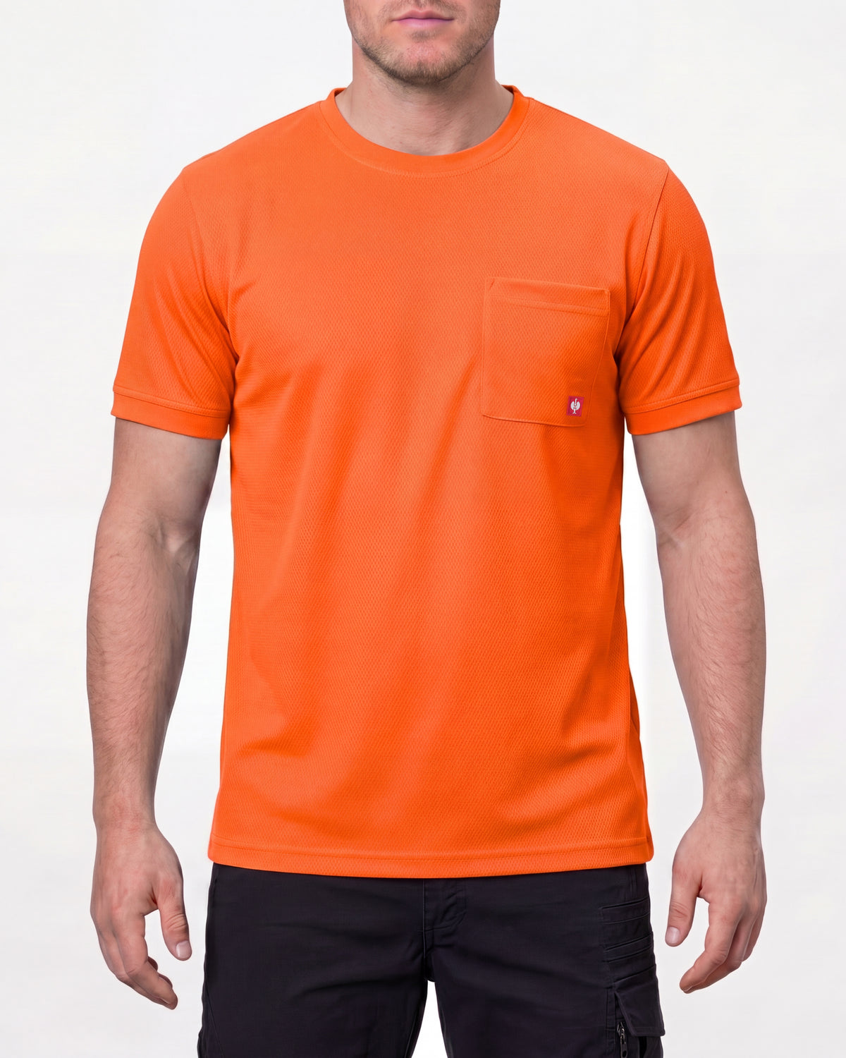 A model wears the STRAUSS Enhanced Visibility Performance T-Shirt in neon orange with dark work pants in a studio product scene