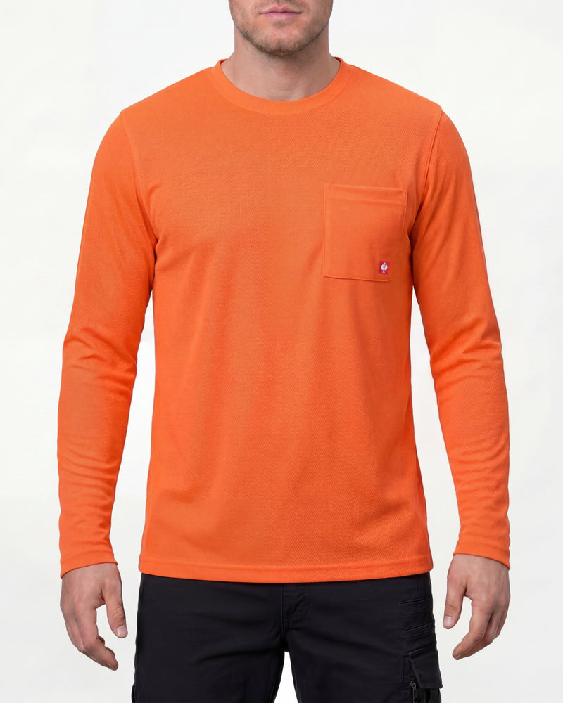 A model wears the STRAUSS Enhanced Visibility Performance Long Sleeve Shirt in neon orange with dark work pants and work boots in a studio product scene