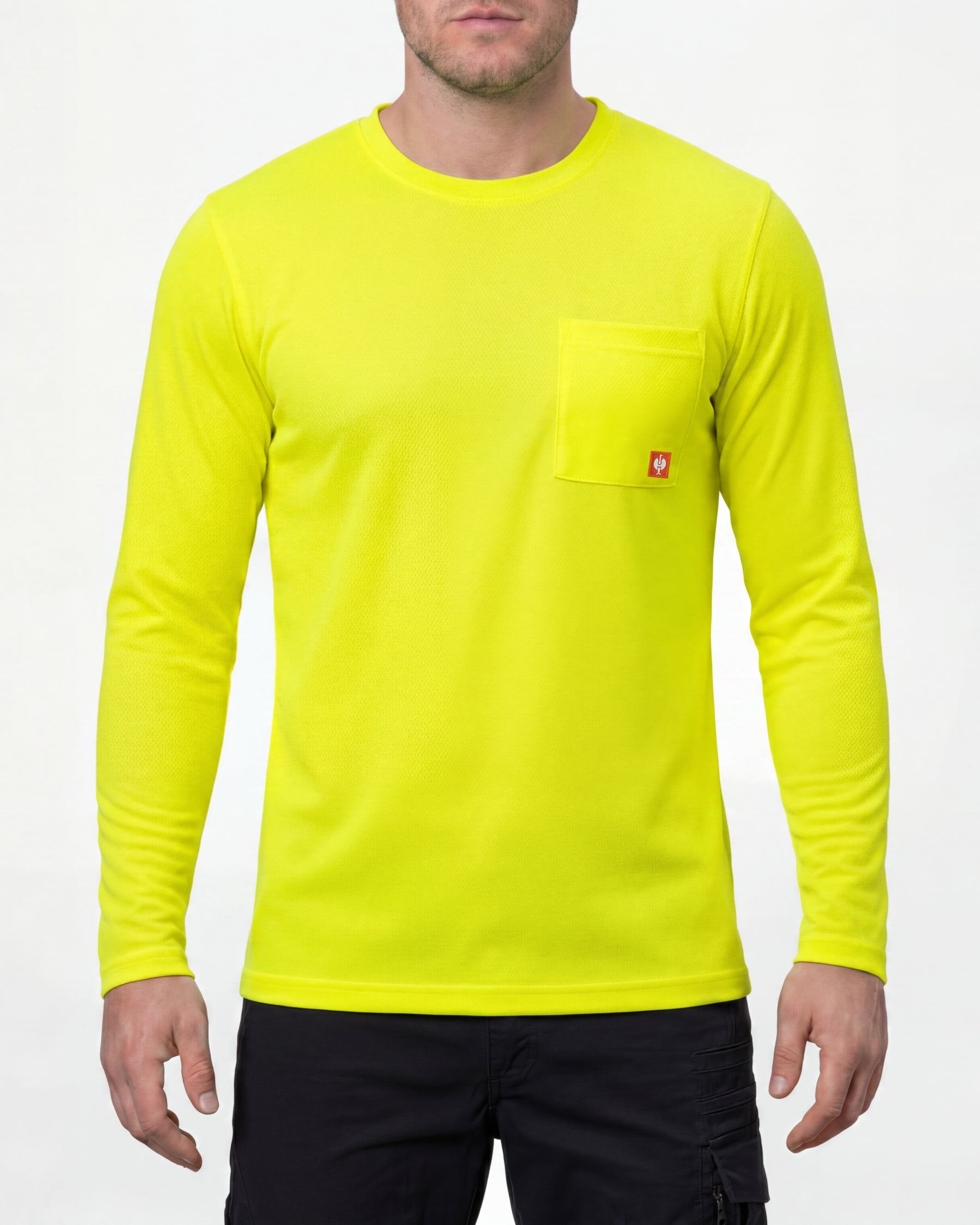 A model wears the STRAUSS Enhanced Visibility Performance Long Sleeve Shirt in neon yellow with dark work pants and work boots in a studio product scene