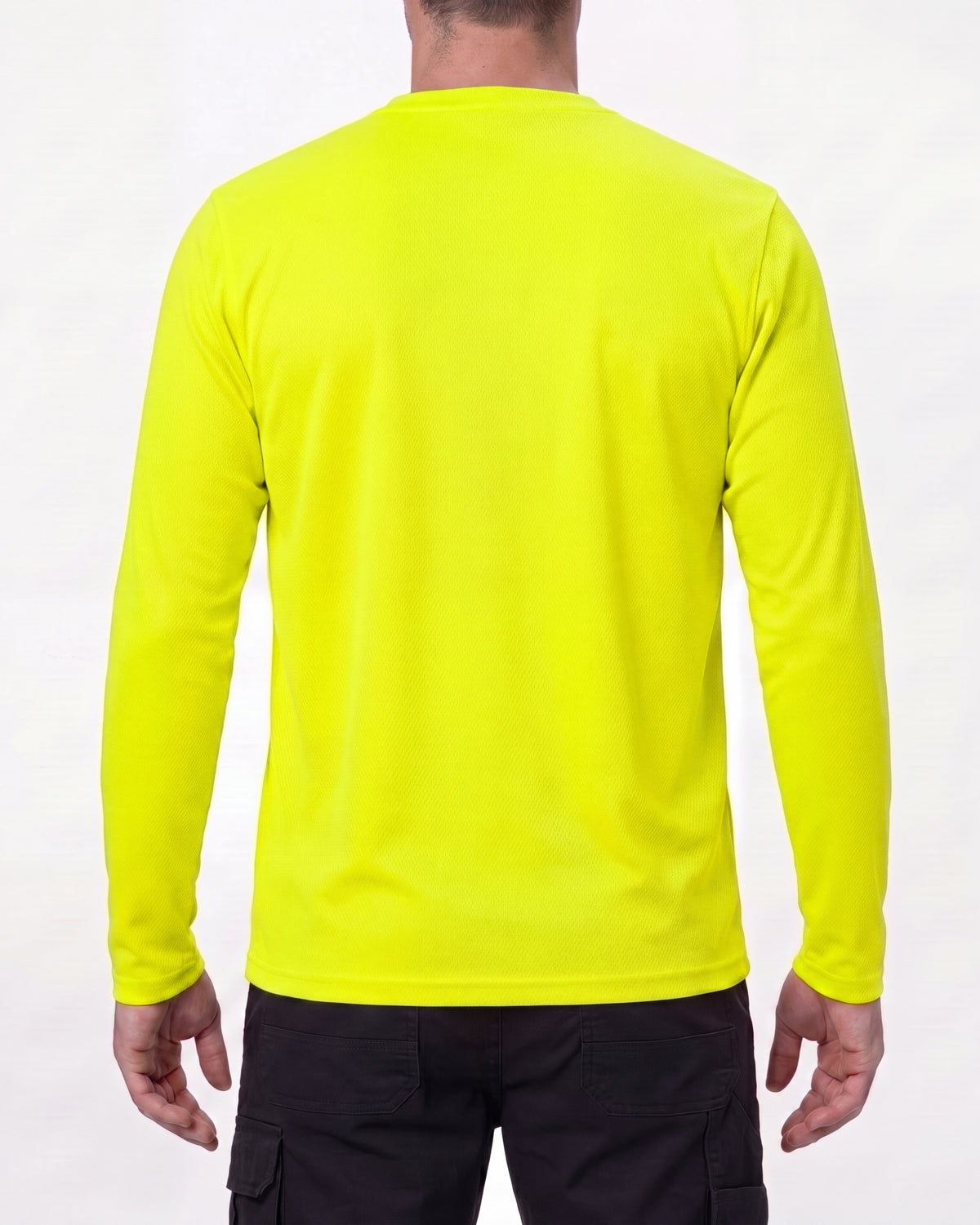 A model wears the STRAUSS Enhanced Visibility Performance Long Sleeve Shirt in neon yellow with dark work pants and work boots, showing the shirt fit