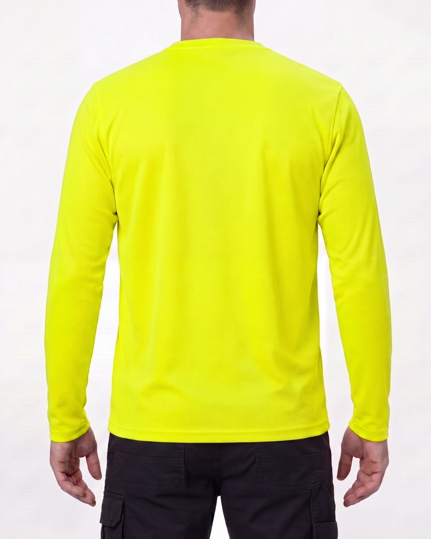 A model wears the STRAUSS Enhanced Visibility Performance Long Sleeve Shirt in neon yellow with dark work pants and work boots, showing the shirt fit