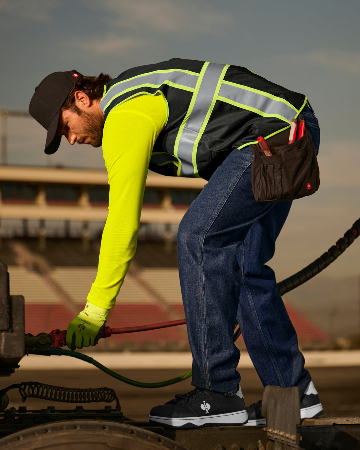 STRAUSS enhanced visibility vest in black paired with work pants