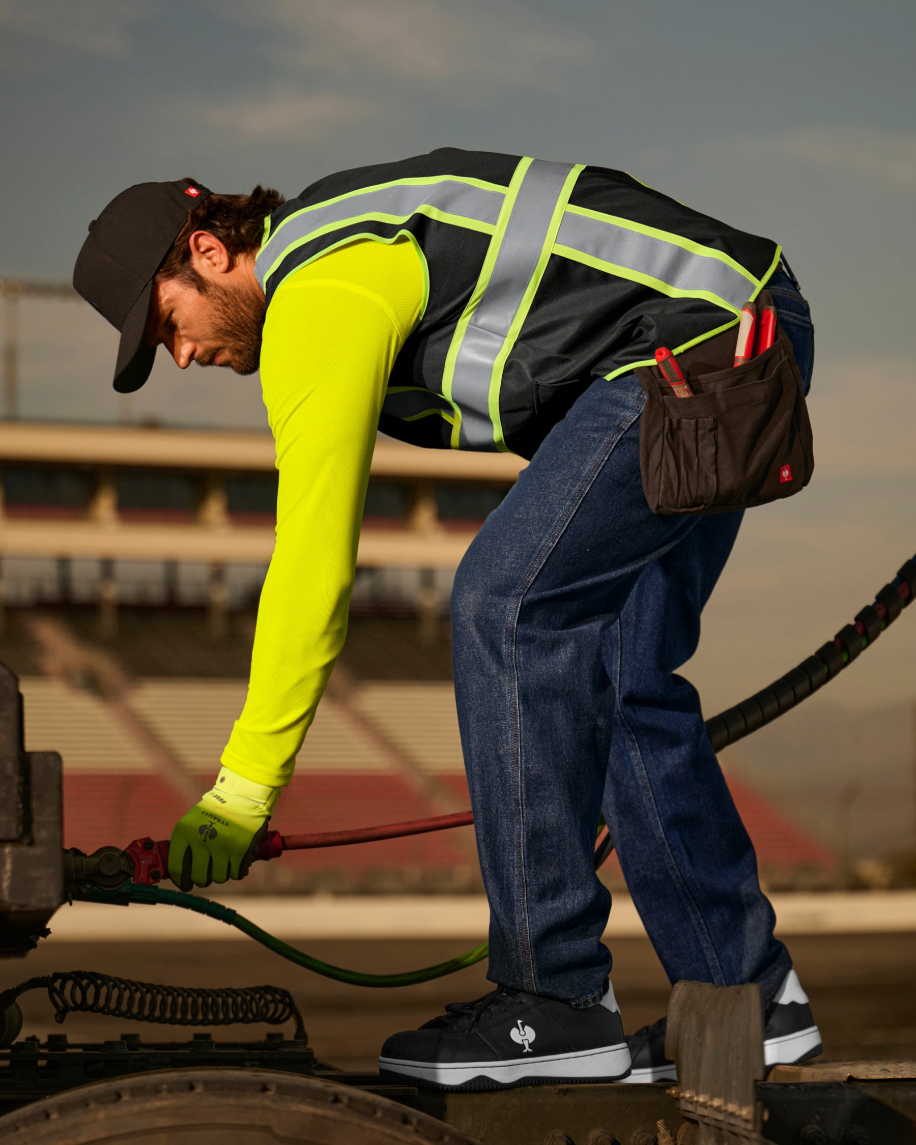 STRAUSS enhanced visibility vest in black paired with work pants