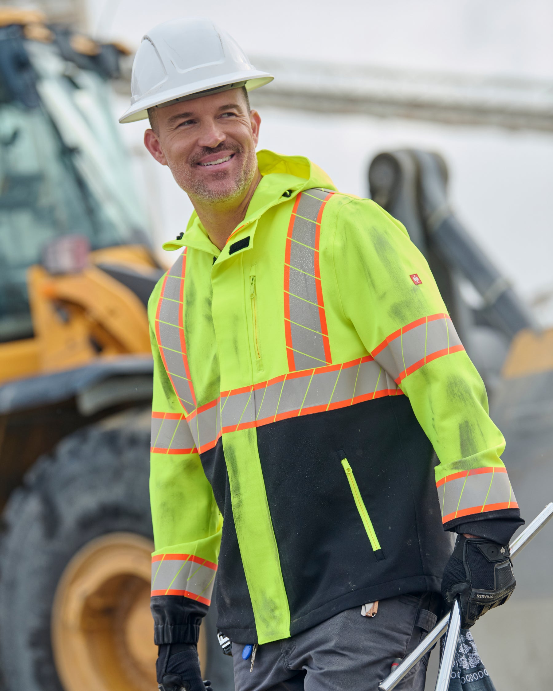 STRAUSS Class 2 high visibility waterproof jacket in neon yellow and black worn for high-visibility work