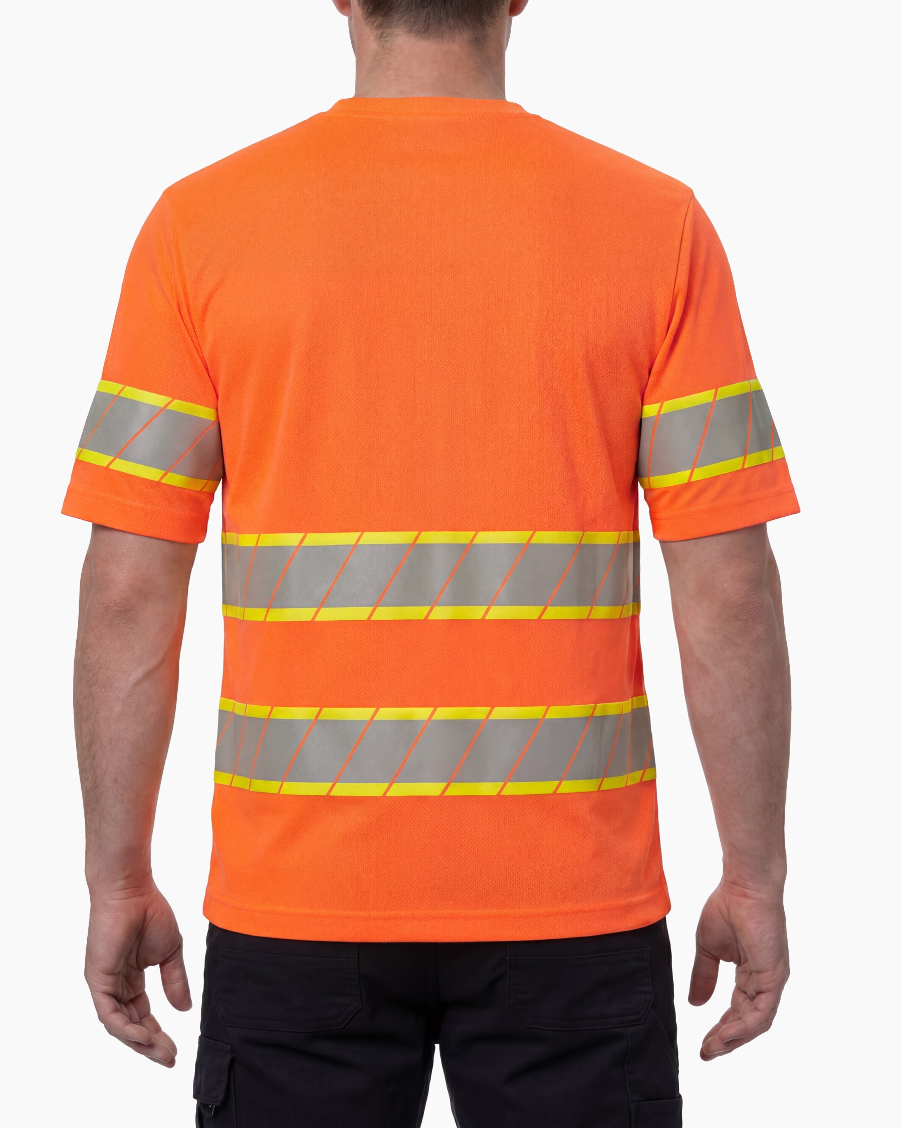 A model wears the STRAUSS Class 2 High Visibility T-Shirt in neon orange with dark work pants and work boots, showing the shirt fit