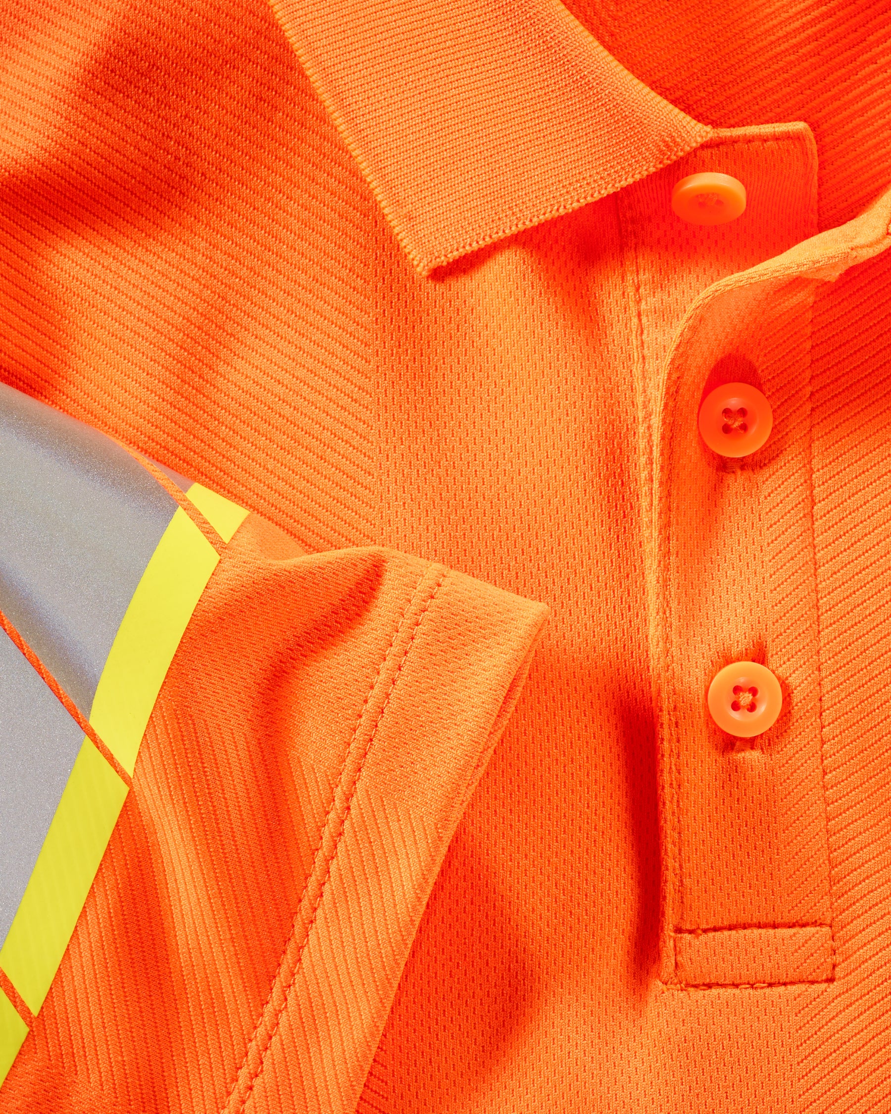 Reflective striping and fluorescent fabric on the STRAUSS Class 2 High Visibility Polo Shirt in neon orange
