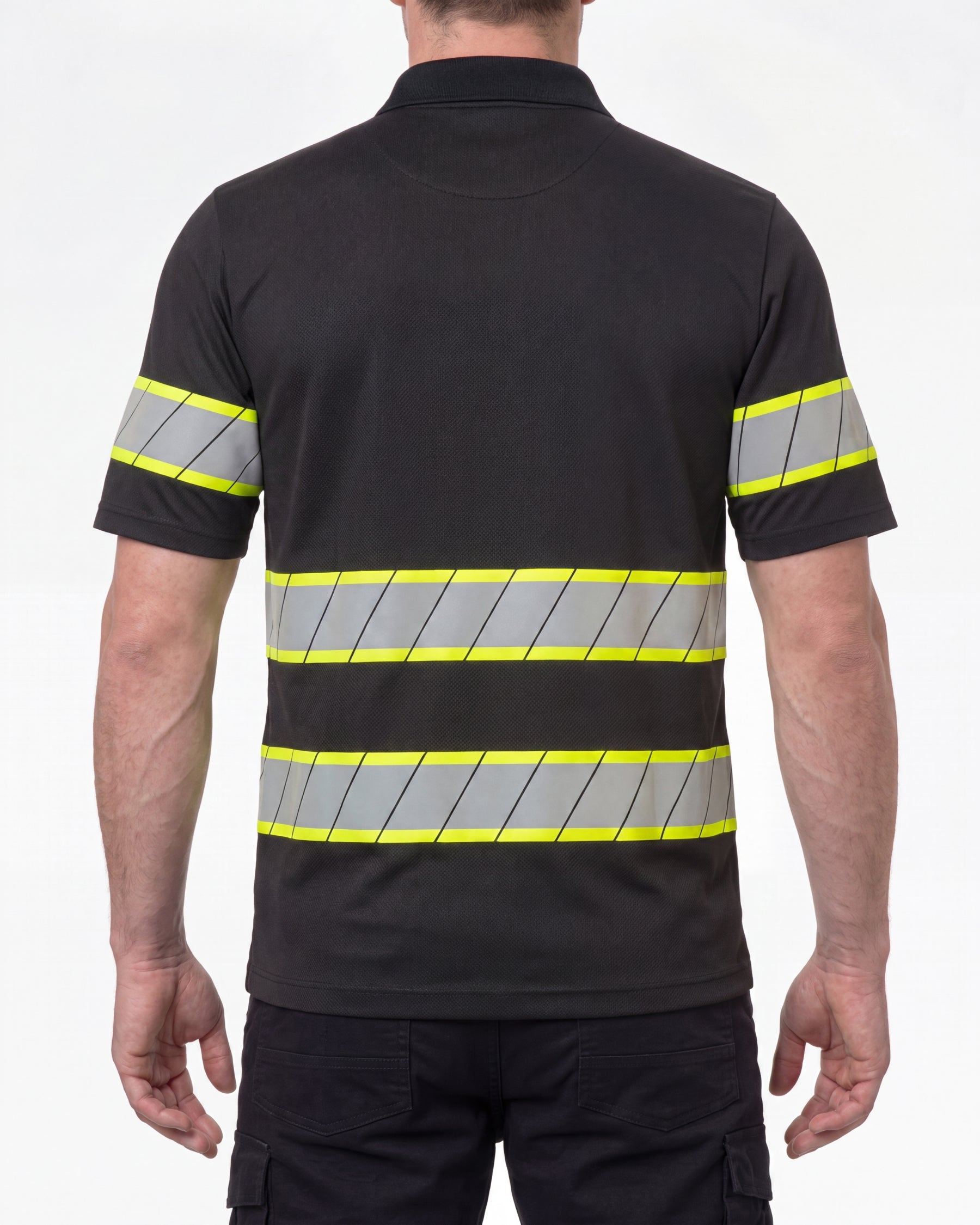 A model wears the STRAUSS Enhanced Visibility Polo Shirt in black with dark work pants and work boots, showing the shirt fit