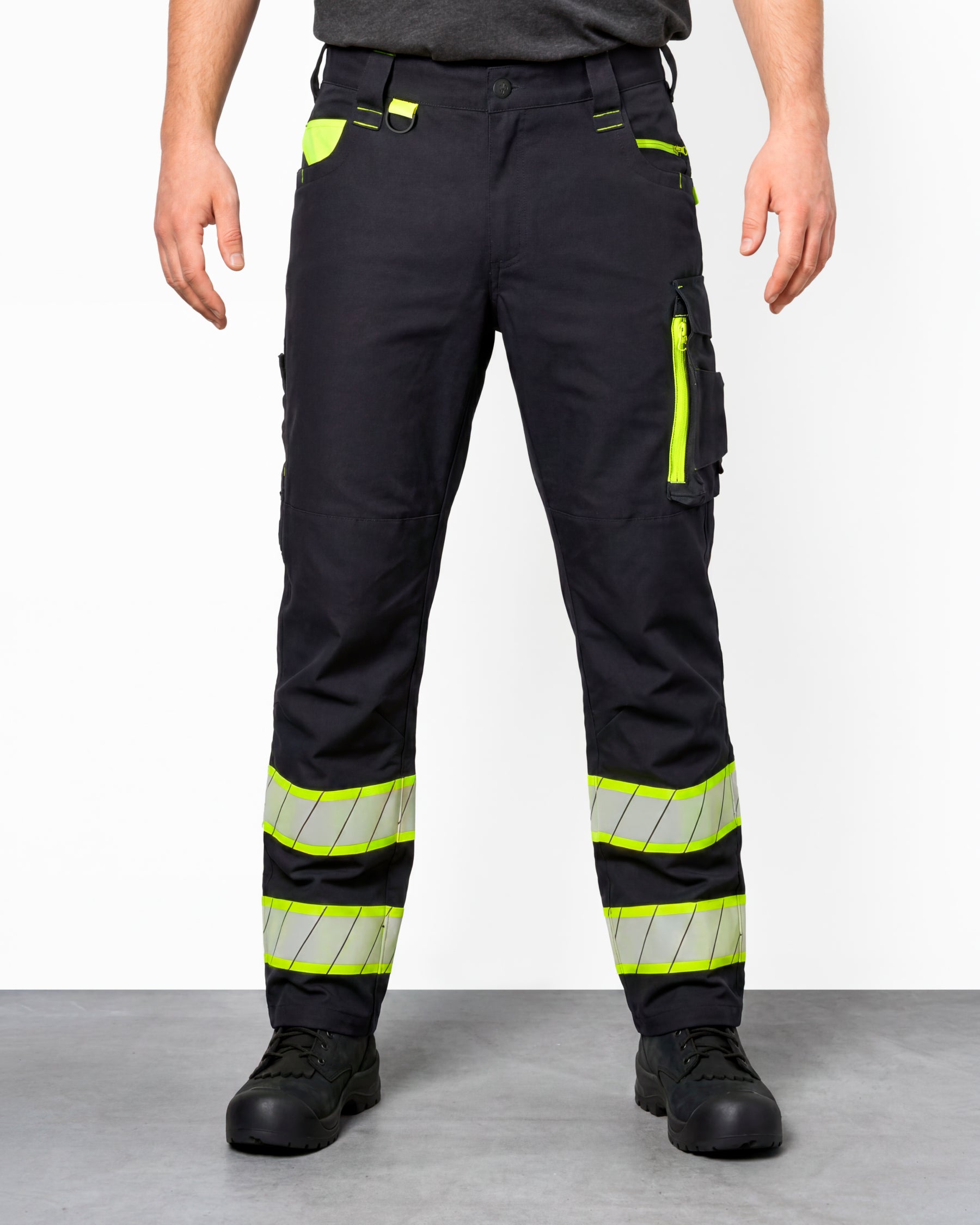 Enhanced Visibility Work Pants in black worn by a model, front view
