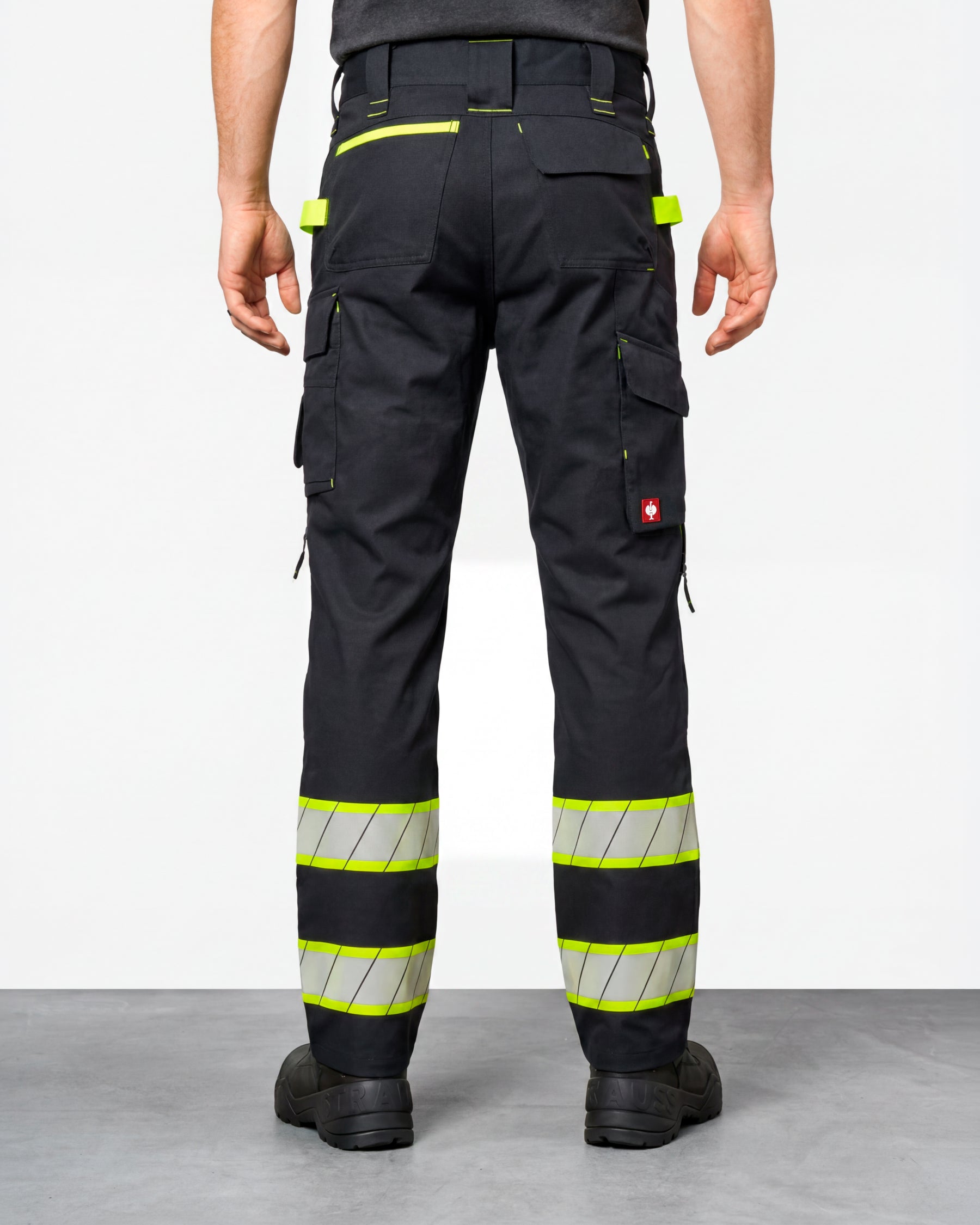Enhanced Visibility Work Pants in black worn by a model, rear view