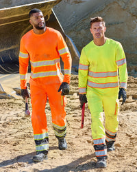 High Visibility Work Pants in neon orange/black shown in an outdoor workwear setting