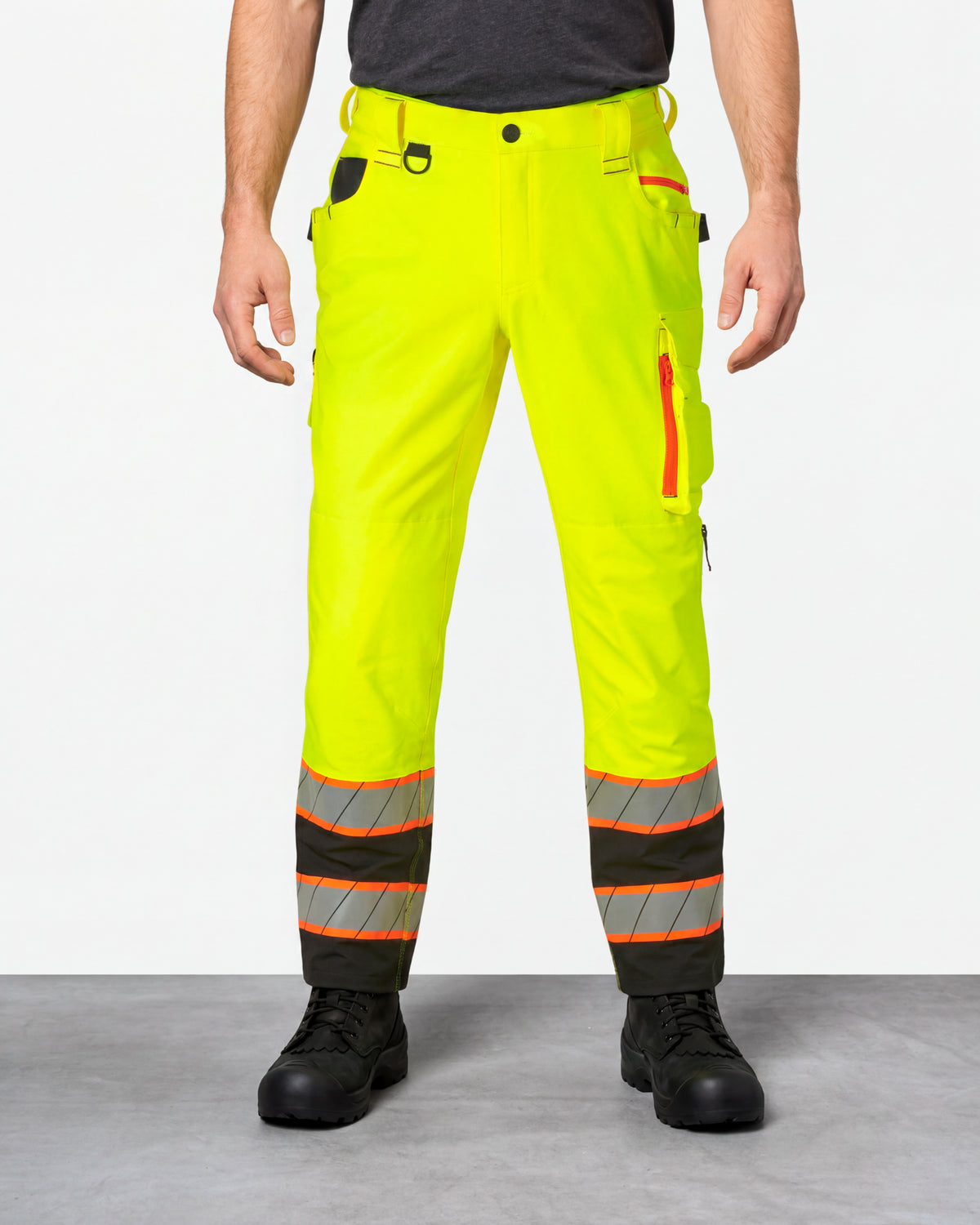 High Visibility Work Pants in neon yellow/black worn by a model, front view