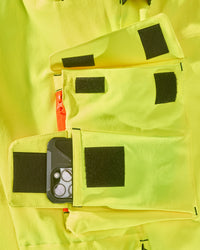 Close-up of reflective workwear details on High Visibility Work Pants in neon yellow/black
