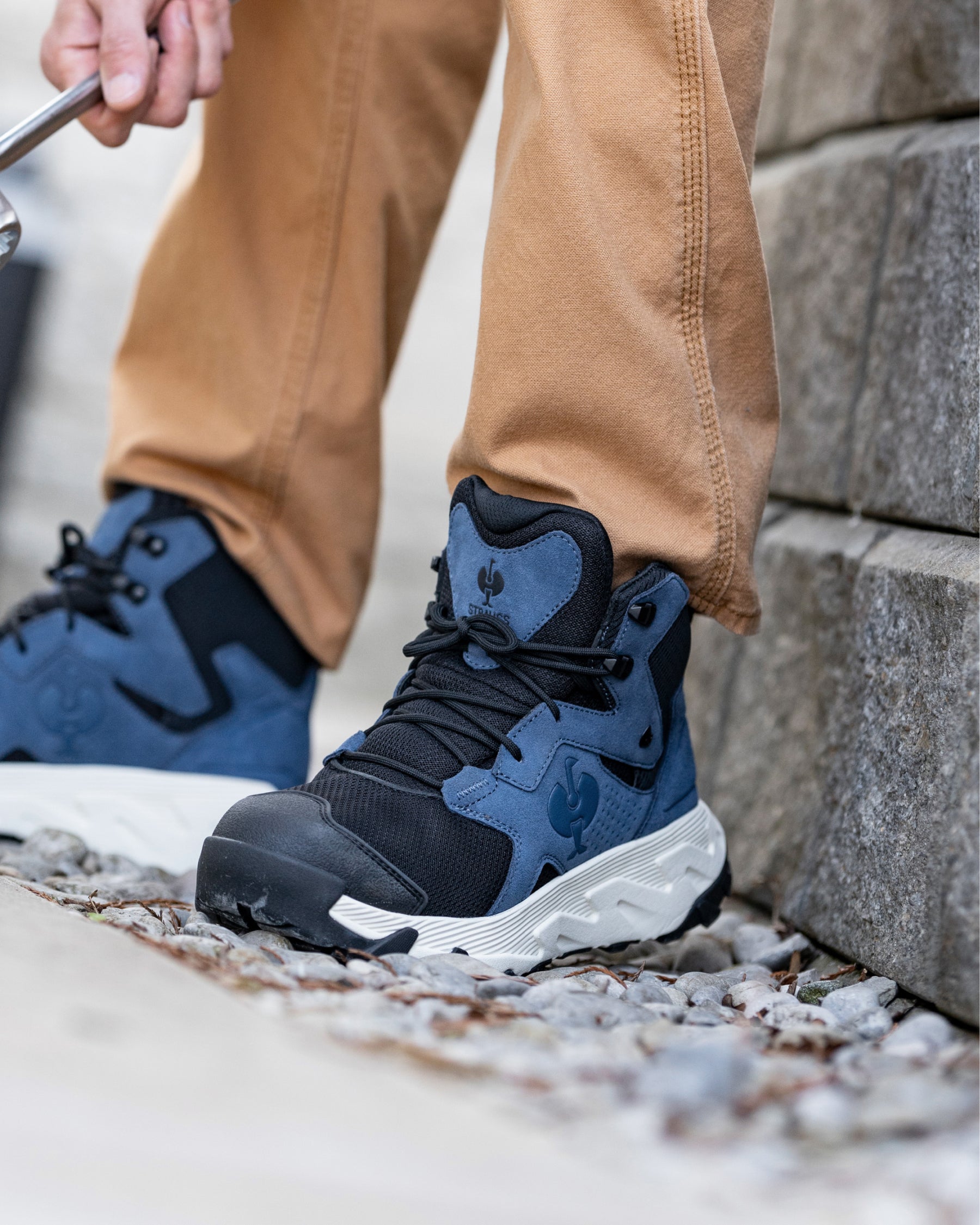 STRAUSS Rimini 6-inch Soft Toe Boot in Oxid blue and Cream shown on rough jobsite ground