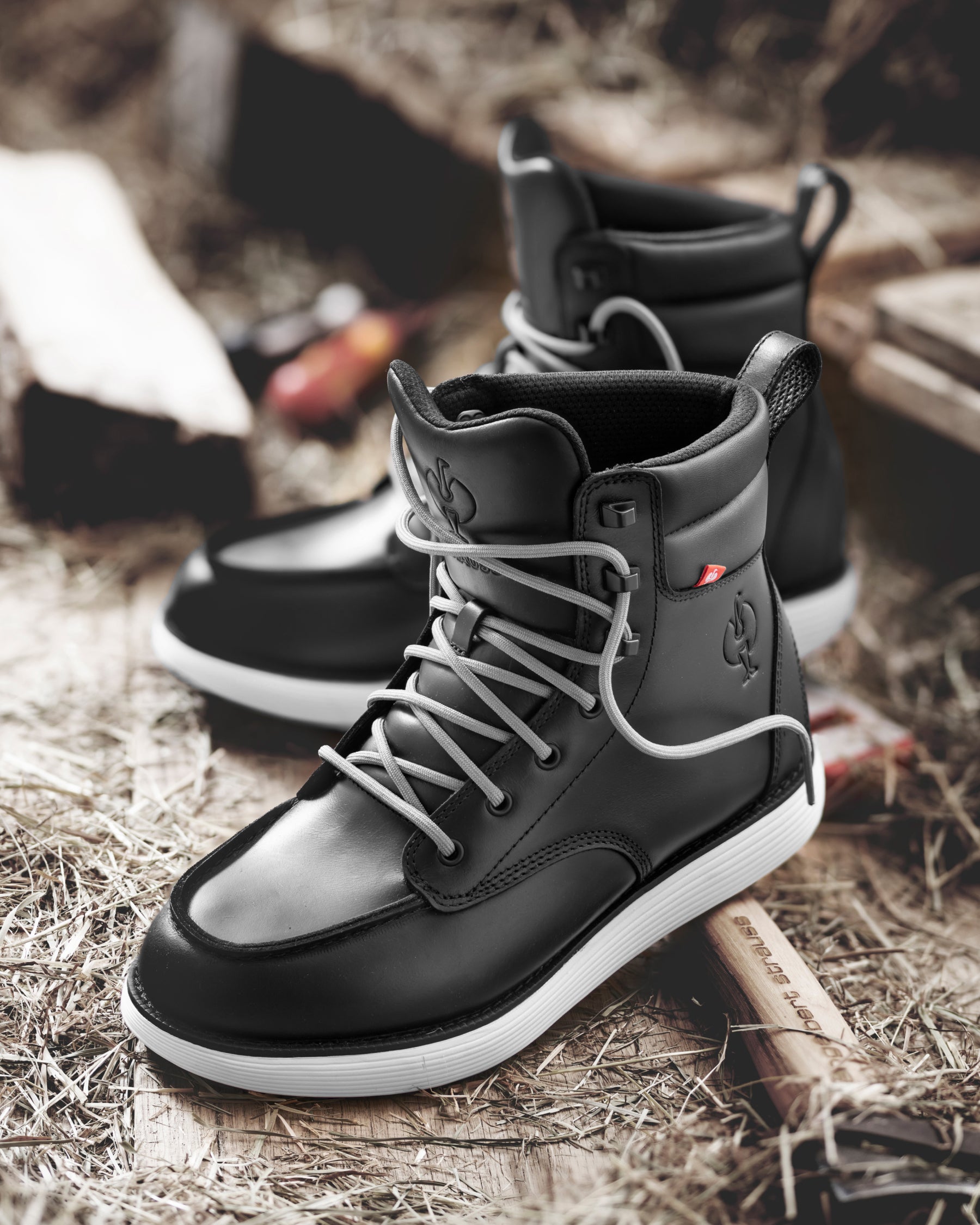 STRAUSS Boulder 6-inch Soft Toe Boot in Black worn in an outdoor work setting