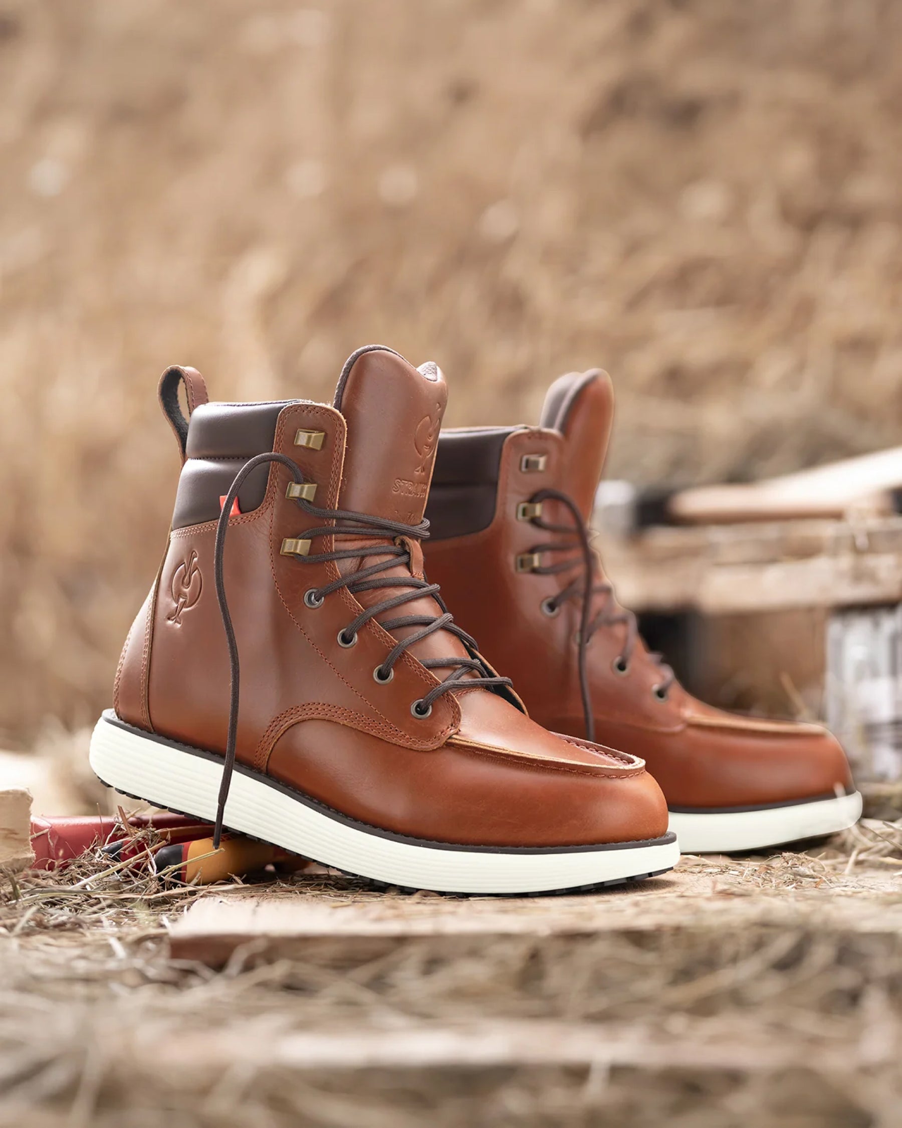 STRAUSS Boulder 6-inch Soft Toe Boot in Red brown worn in an outdoor work setting