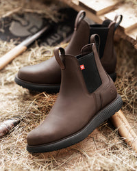 STRAUSS Amarillo 6-inch Soft Toe Chelsea Boot in Marsh brown shown in use on the job