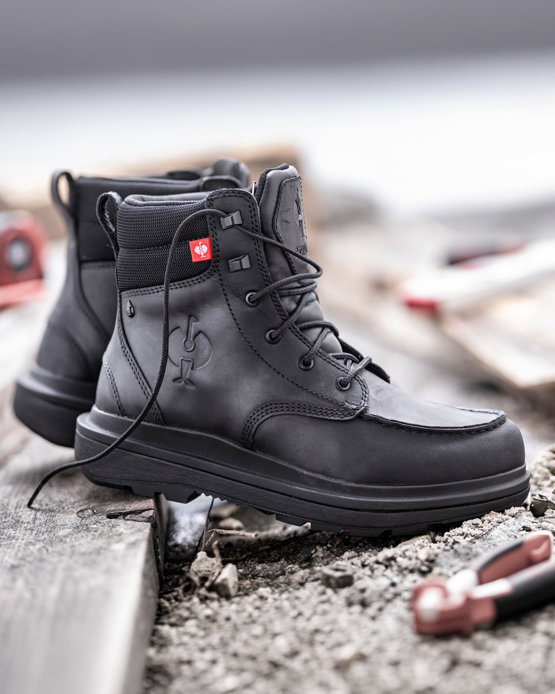 STRAUSS Ridgewood 6-inch Soft Toe Boot in Black worn in an outdoor work setting
