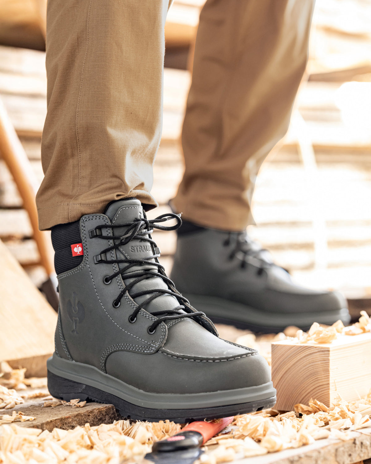 STRAUSS Ridgewood 6-inch Soft Toe Boot in Carbon gray shown on rough jobsite ground