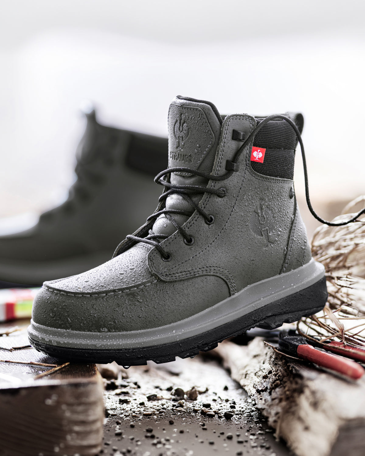 STRAUSS Ridgewood 6-inch Soft Toe Boot in Carbon gray shown in use on the job